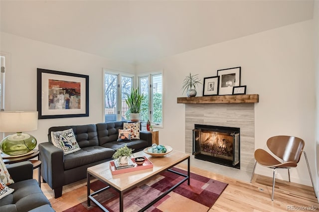 4565 E Mexico Ave Unit 3, Denver, CO 80222 - living room with wood finished floors and a tile fireplace