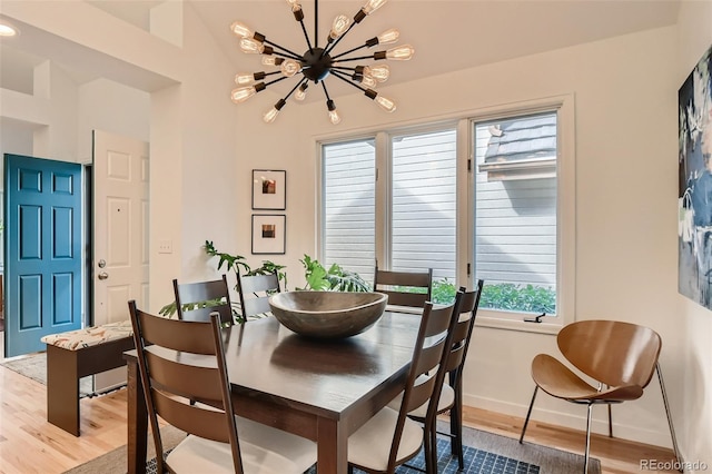 4565 E Mexico Ave Unit 3, Denver, CO 80222 - dining space with wood finished floors and a chandelier