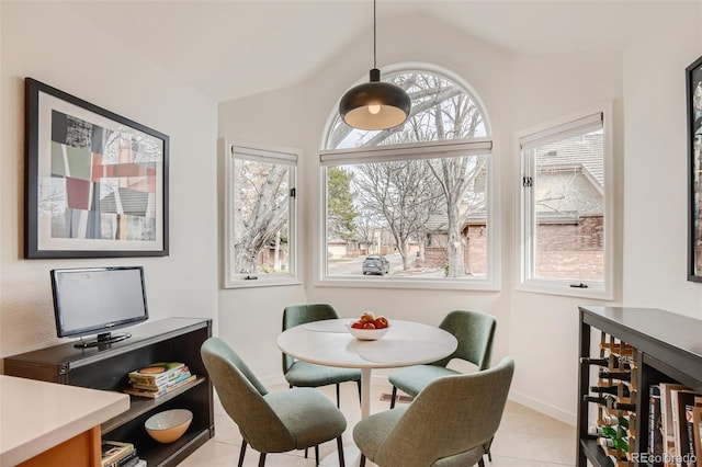 4565 E Mexico Ave Unit 3, Denver, CO 80222 - dining room featuring light tile patterned flooring and lofted ceiling