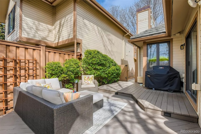 4565 E Mexico Ave Unit 3, Denver, CO 80222 - wooden deck with an outdoor living space and area for grilling