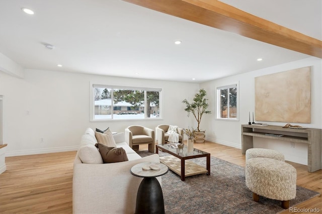 living area with recessed lighting, baseboards, and light wood finished floors