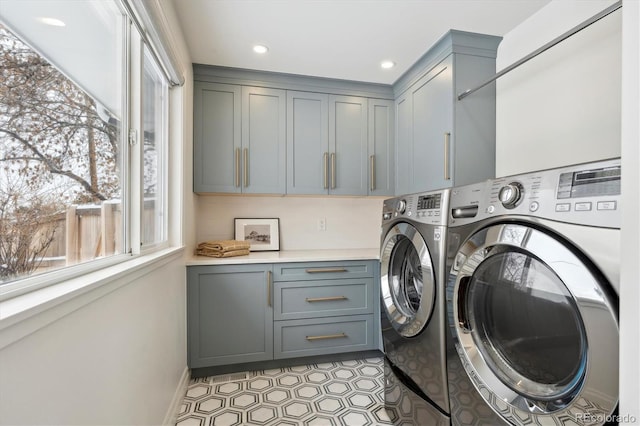 laundry area featuring cabinet space, washer and dryer, and recessed lighting