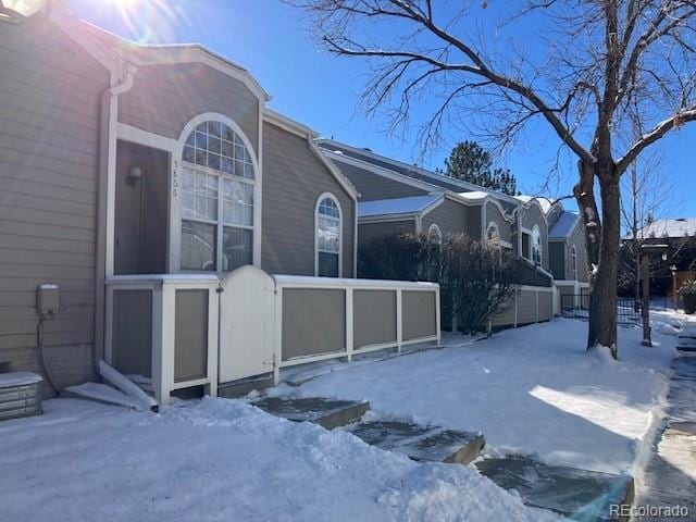 view of snow covered property