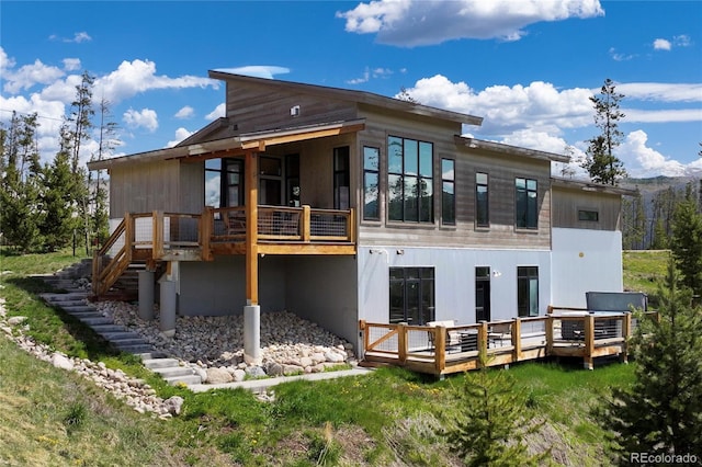 610 Mulligan St, Fraser, CO 80442 - rear view of house with stairway and a deck