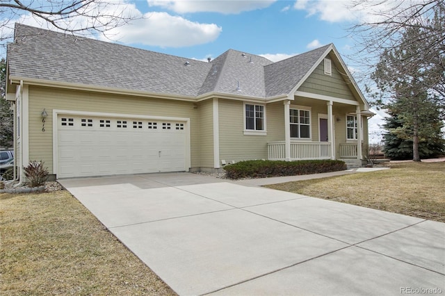 view of front of house featuring a porch, a shingled roof, concrete driveway, a garage, and a front lawn