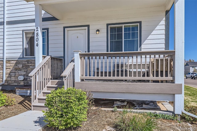 4355 24th Street Rd Unit 2804, Greeley, CO 80634 - doorway to property with covered porch and stone siding