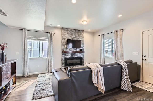 4355 24th Street Rd Unit 2804, Greeley, CO 80634 - living room featuring dark wood-style flooring, a fireplace, baseboards, and recessed lighting
