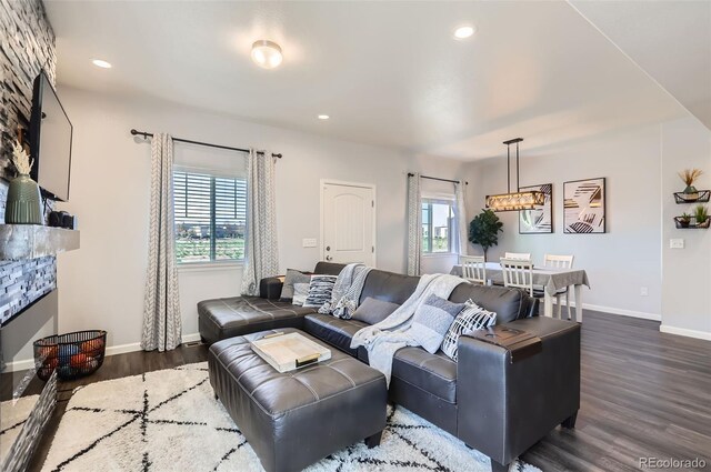 4355 24th Street Rd Unit 2804, Greeley, CO 80634 - living room with baseboards, healthy amount of natural light, dark wood-style flooring, and recessed lighting