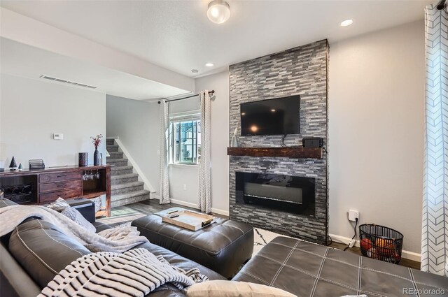 4355 24th Street Rd Unit 2804, Greeley, CO 80634 - living area featuring baseboards, stairs, a fireplace, wood finished floors, and recessed lighting