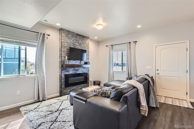 4355 24th Street Rd Unit 2804, Greeley, CO 80634 - living area featuring wood finished floors, a large fireplace, baseboards, and recessed lighting