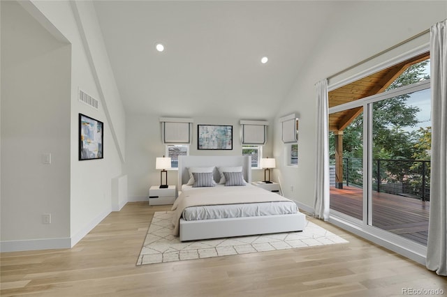 bedroom featuring access to exterior, light wood-type flooring, visible vents, and baseboards