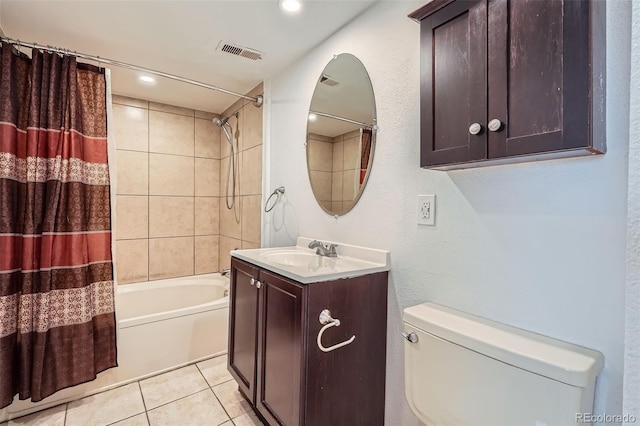 bathroom featuring vanity, toilet, tile patterned floors, shower / bathtub combination with curtain, and visible vents