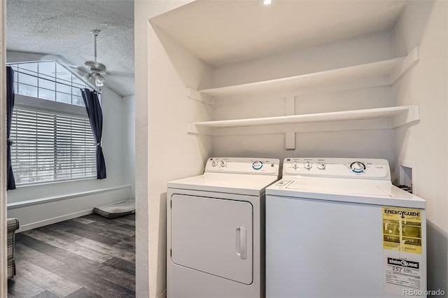 clothes washing area with plenty of natural light, laundry area, wood finished floors, and washer and dryer