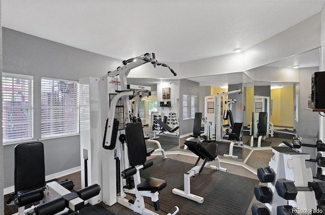 workout area featuring baseboards