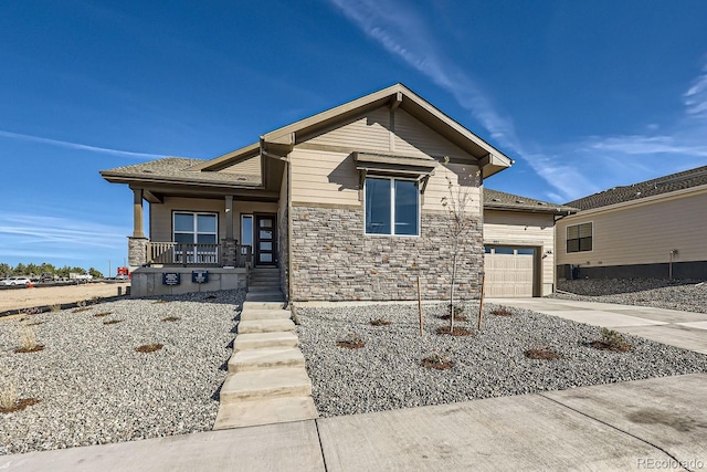 view of front of home featuring a porch and a garage