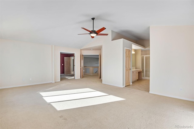 interior space featuring light colored carpet, ceiling fan, and lofted ceiling