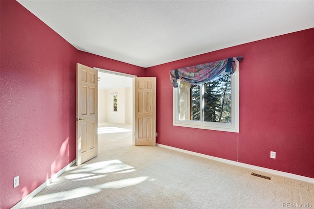 empty room with carpet flooring