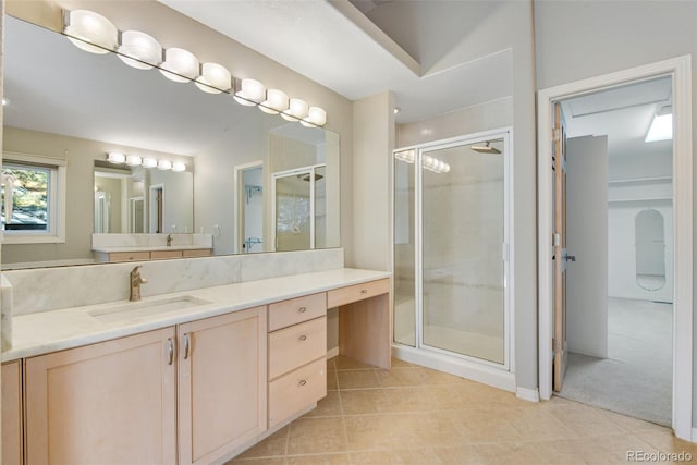 bathroom featuring vanity and a shower with shower door