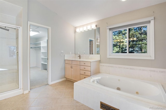 bathroom with tile patterned flooring, vanity, separate shower and tub, and lofted ceiling