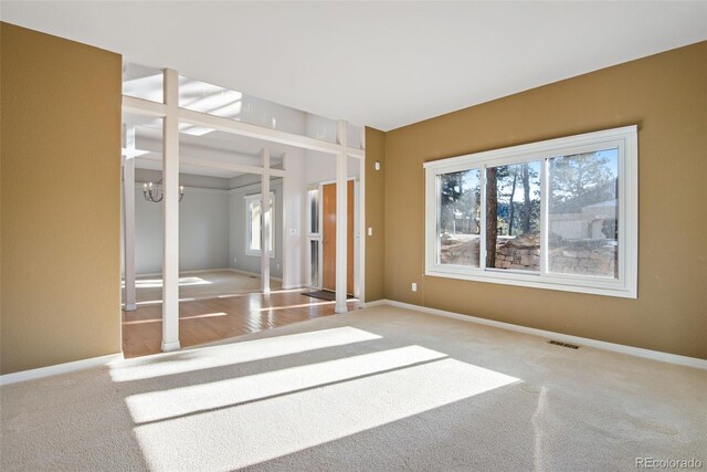 unfurnished room with light carpet