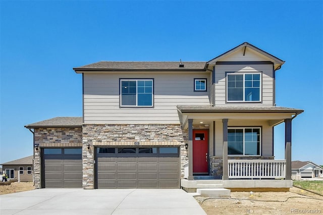 9910 Biscay St, Commerce City, CO 80022 - view of front of house with a porch, stone siding, and concrete driveway