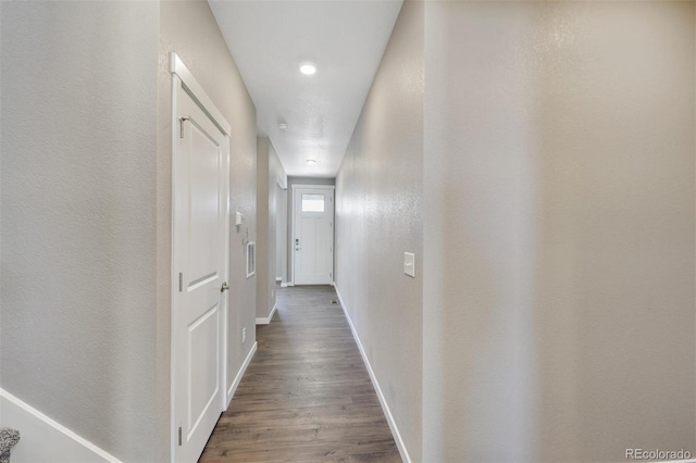 9910 Biscay St, Commerce City, CO 80022 - corridor featuring wood finished floors and baseboards
