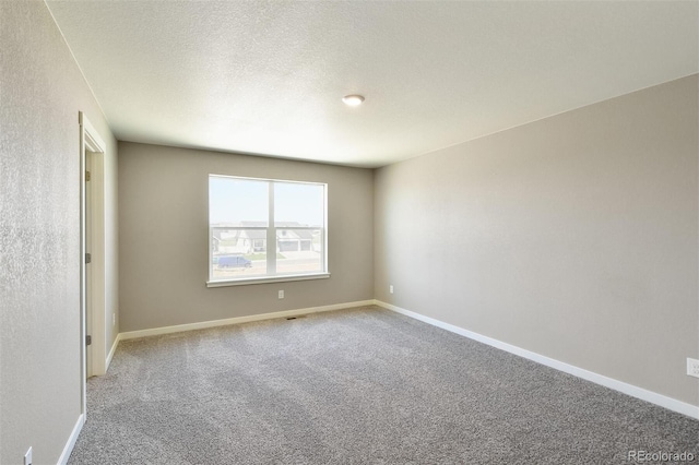 9910 Biscay St, Commerce City, CO 80022 - spare room with carpet and a textured ceiling