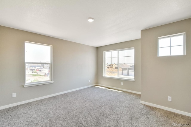 9910 Biscay St, Commerce City, CO 80022 - unfurnished room featuring plenty of natural light and carpet floors