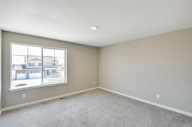 9910 Biscay St, Commerce City, CO 80022 - carpeted empty room with baseboards