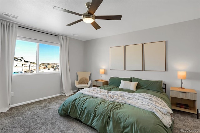 bedroom featuring ceiling fan and carpet