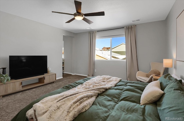 bedroom with dark colored carpet and ceiling fan