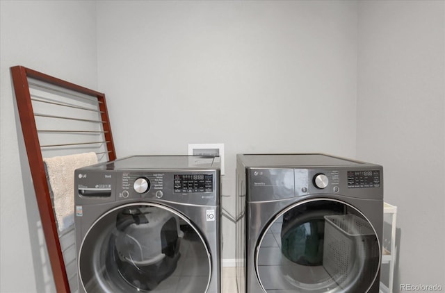 clothes washing area featuring washing machine and dryer