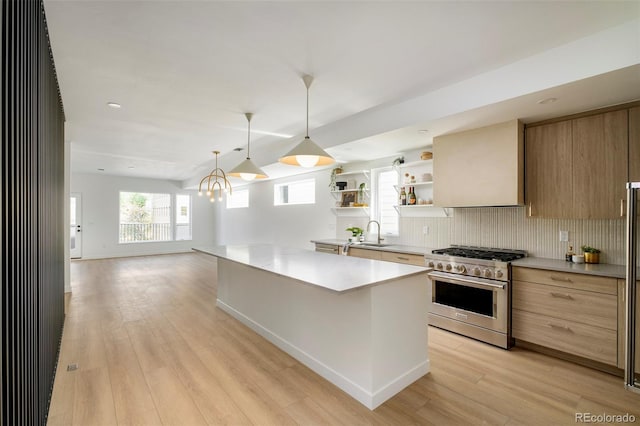 kitchen featuring stainless steel stove, open shelves, modern cabinets, tasteful backsplash, and light wood finished floors