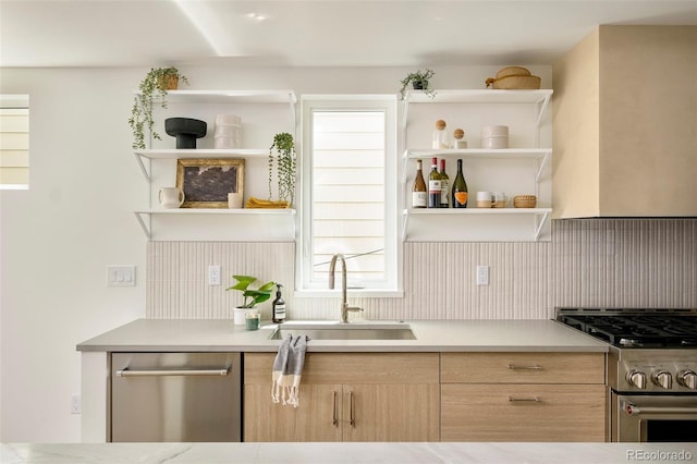 kitchen featuring appliances with stainless steel finishes, a sink, open shelves, light brown cabinetry, and tasteful backsplash