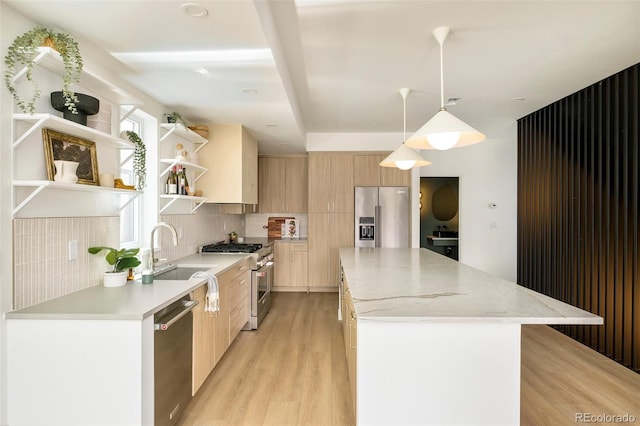 kitchen featuring appliances with stainless steel finishes, a sink, modern cabinets, and open shelves