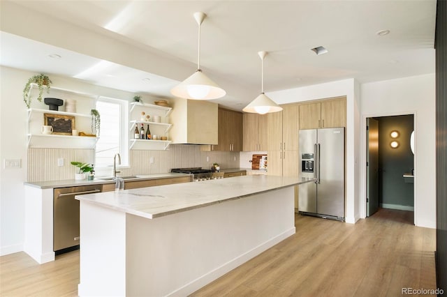 kitchen with stainless steel appliances, open shelves, a kitchen island, backsplash, and light wood-style floors