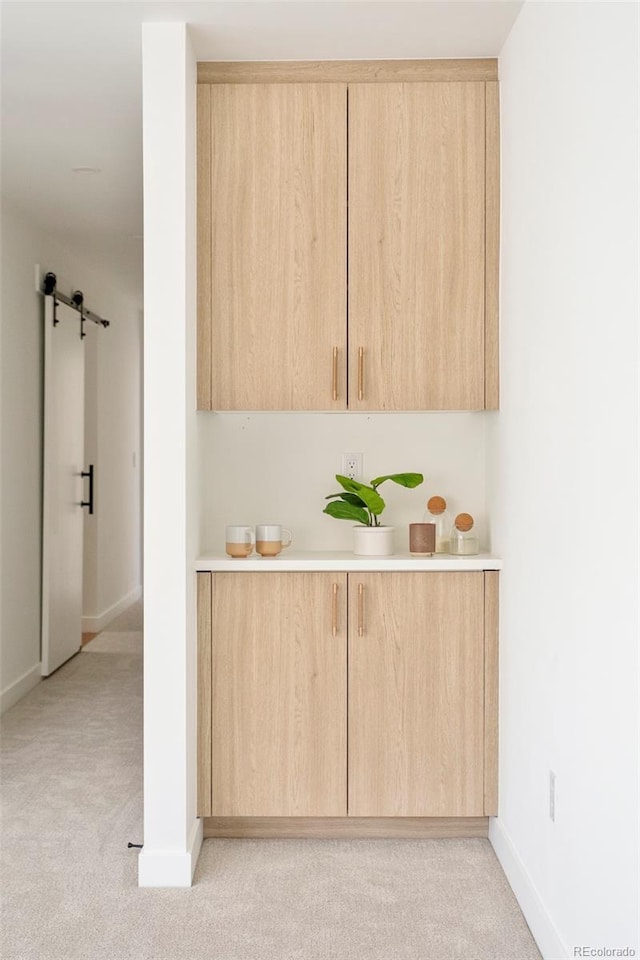 bar with baseboards and light carpet