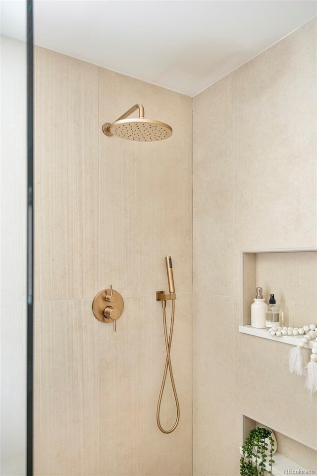 bathroom view of tiled shower