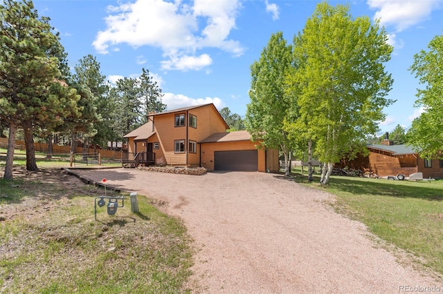 1345 Leslie Cir, Woodland Park, CO 80863 - view of front of property with a garage and driveway