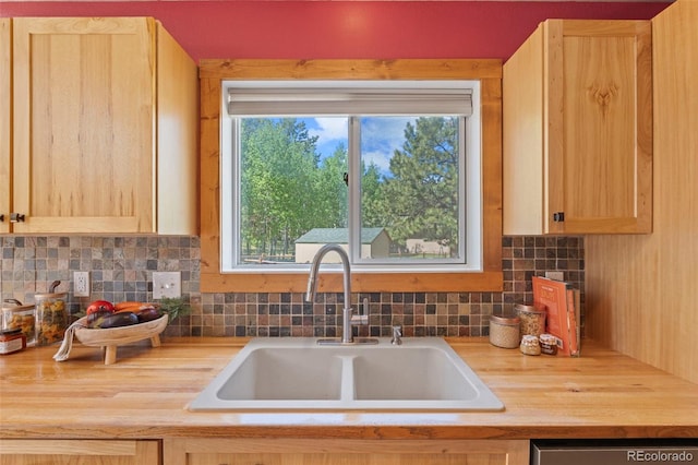1345 Leslie Cir, Woodland Park, CO 80863 - kitchen featuring butcher block counters, light brown cabinetry, decorative backsplash, and stainless steel dishwasher