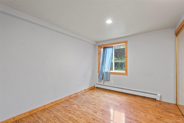 1345 Leslie Cir, Woodland Park, CO 80863 - empty room with a baseboard radiator, light wood-style floors, and recessed lighting