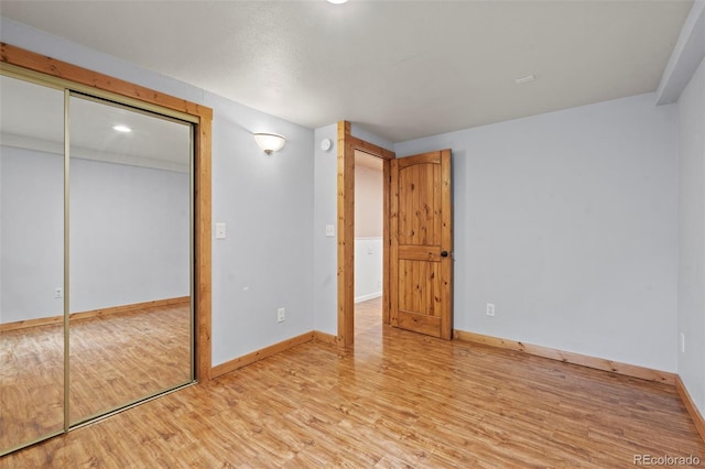 1345 Leslie Cir, Woodland Park, CO 80863 - unfurnished bedroom with light wood-style floors and a closet