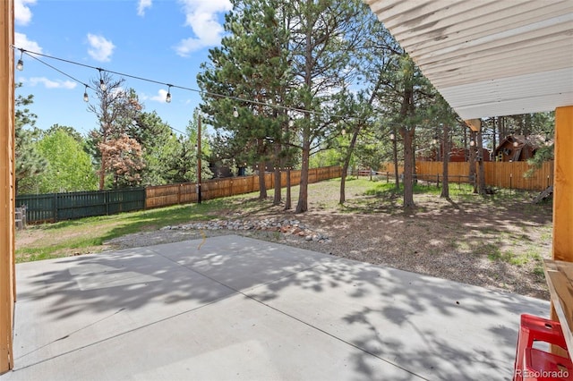1345 Leslie Cir, Woodland Park, CO 80863 - fenced backyard with a patio area