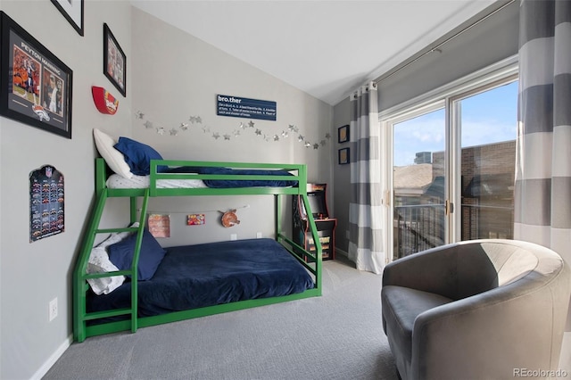 bedroom featuring carpet and lofted ceiling