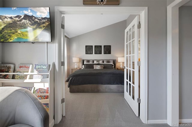 bedroom with carpet flooring, french doors, and lofted ceiling