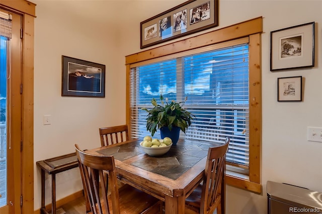 dining room with wood finished floors and baseboards