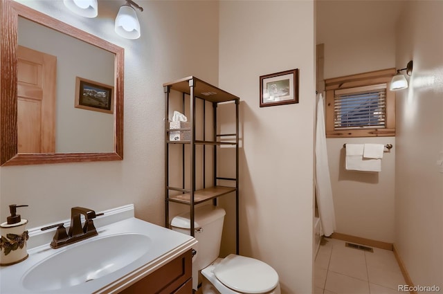 bathroom featuring toilet, vanity, visible vents, tile patterned floors, and shower / bath combination with curtain