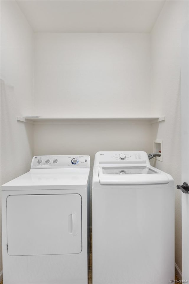 clothes washing area with independent washer and dryer