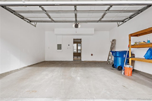 garage featuring a garage door opener and electric panel