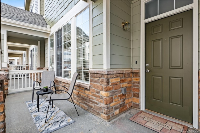 entrance to property featuring a porch